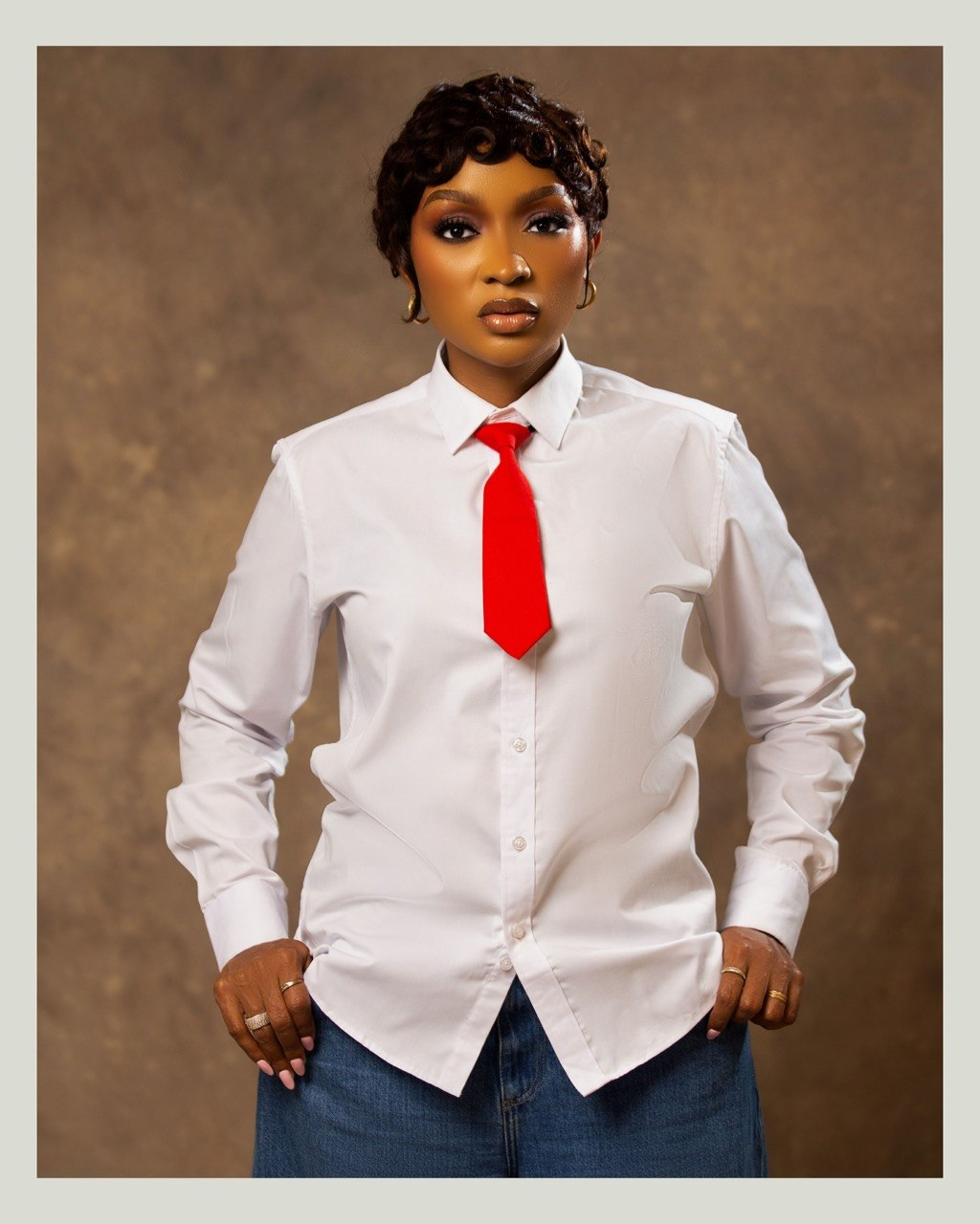 Favour Aruwei in a white shirt and red tie
